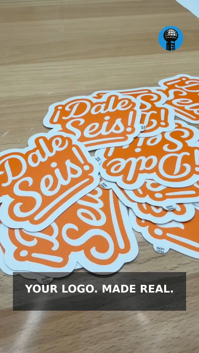 Finished orange custom-cut stickers made by Knox Sticker Co.